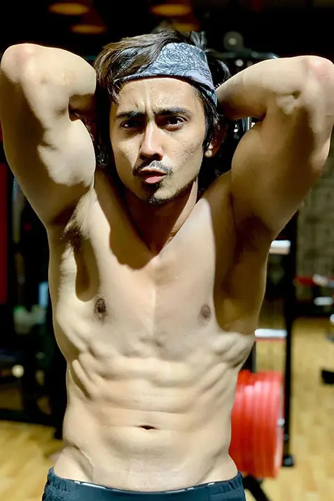 Adnaan Shaikh showing his muscular body