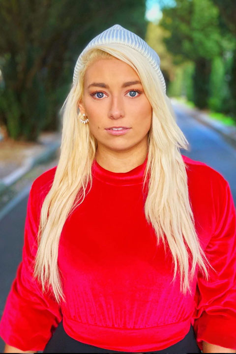 Alexandria Knight in red shirt and blonde hairs