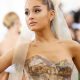 Ariana Grande in sleeveless dress and white head bow