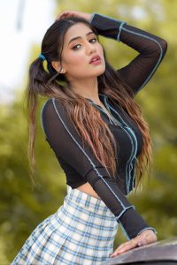 Famous Indian Tiktok Star Garima Chaurasia is looking beautiful in black blouse and ponytail.