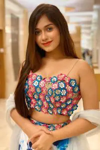 Jannat Zubair Rahmani wearing flower sleeveless blouse and looking with her beautiful blue eyes