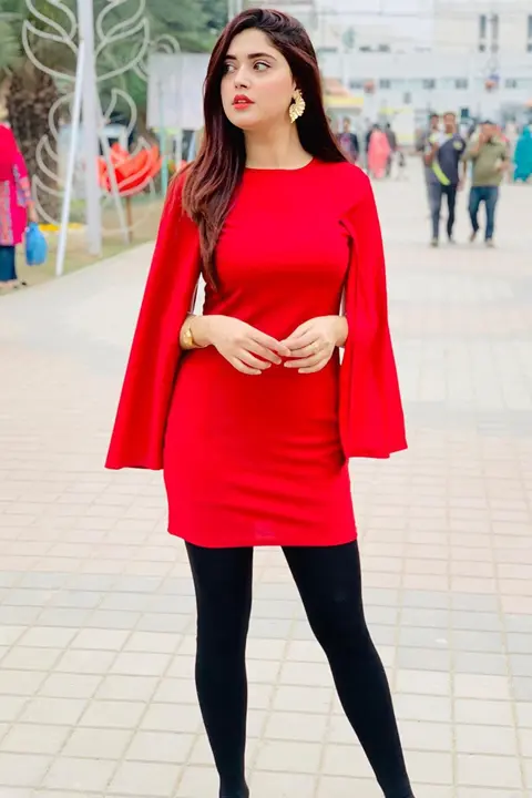 Kanwal Aftab in dark red dress complementing her healthy curvy physique