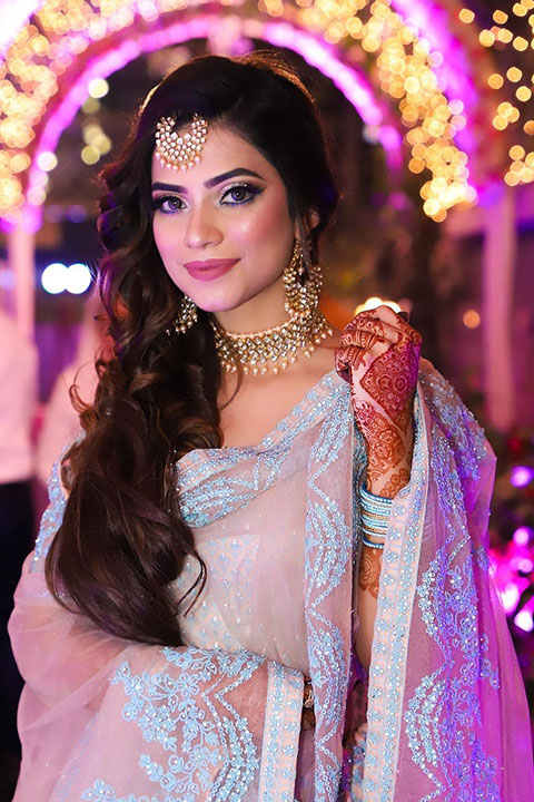 Nagma Mirajkar in beautiful sari and mehandi henna on her hands