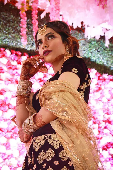 Nagma Mirajkar in beautiful black and golden sari with mehandi on hands