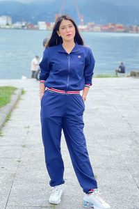 Pinky Francis at port in blue pent shirt and white joggers
