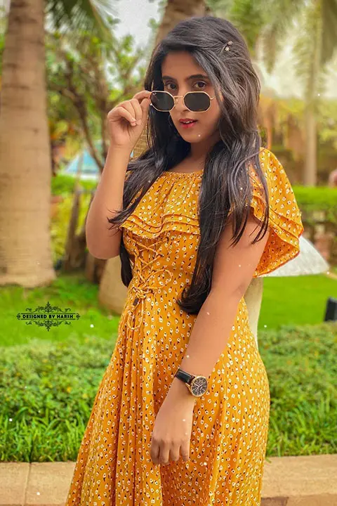 Sameeksha Sud is looking confident in her yellow dress and black glasses