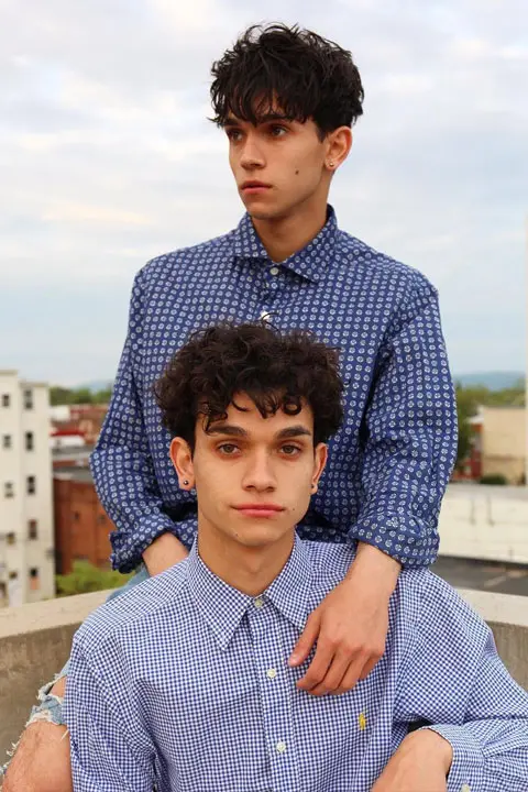 The Dobre Twins wearing check shirts and showing their cute and handsome smiles.