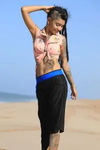 Wish Rathod in pink blouse, showing her tattoos. Enjoying at beach by playing with her twin tails