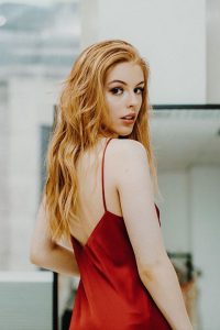 Amelia Gething in red dress