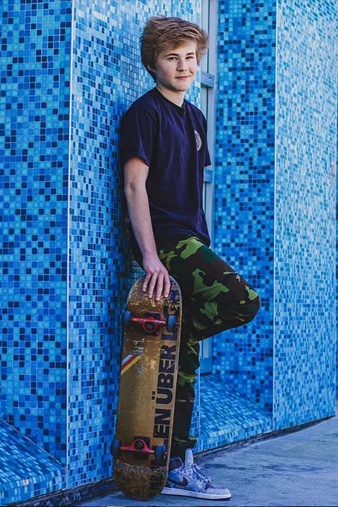 Casey Simpson with his skateboard