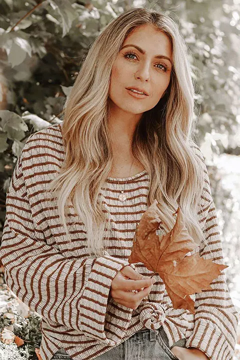 Chantelle Paige Soutas enjoying autumn season with a dry leaf in her hand