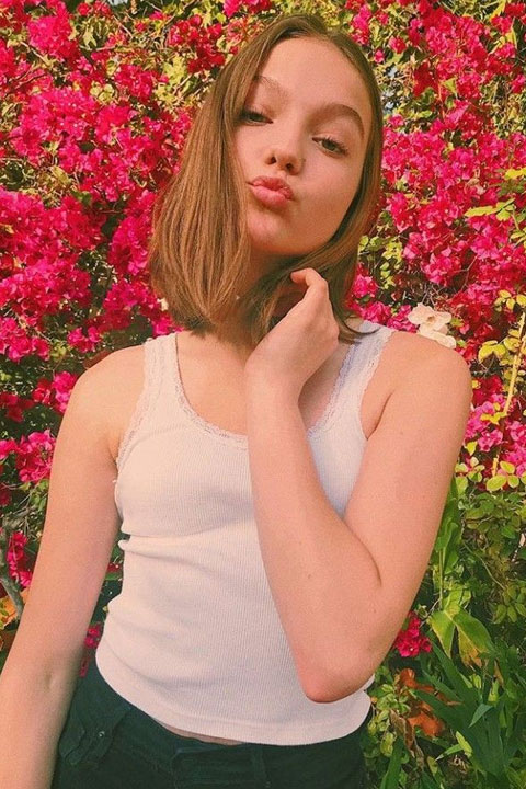 Jayden Bartels is posing for a picture in white shirt.