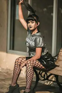 Nisha Guragain confidently show her goth side with black stocking, black lipstick, and grey Shirt