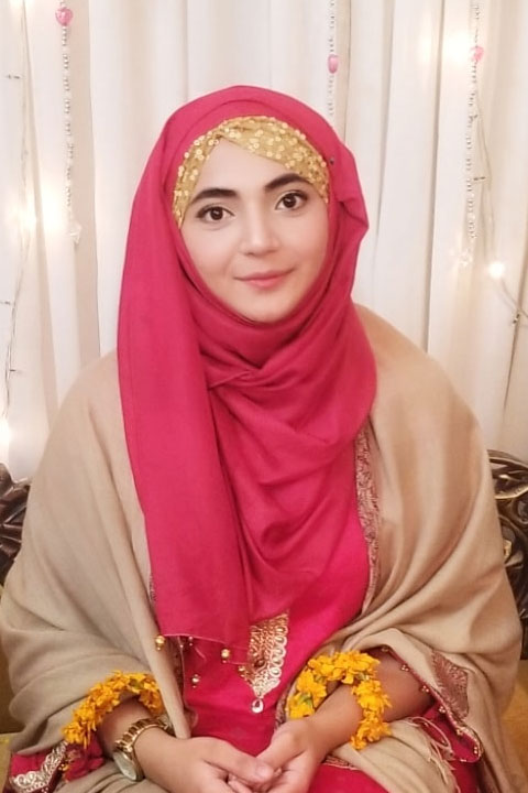 Zahra Haidery with brown shawal and red abbaya