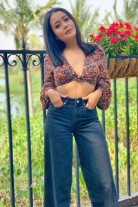 Neha kakkar looking stunning in colorful blouse with her hands on her belly