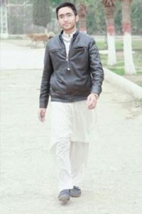 Hasham Ahmed wearing black jacket at park