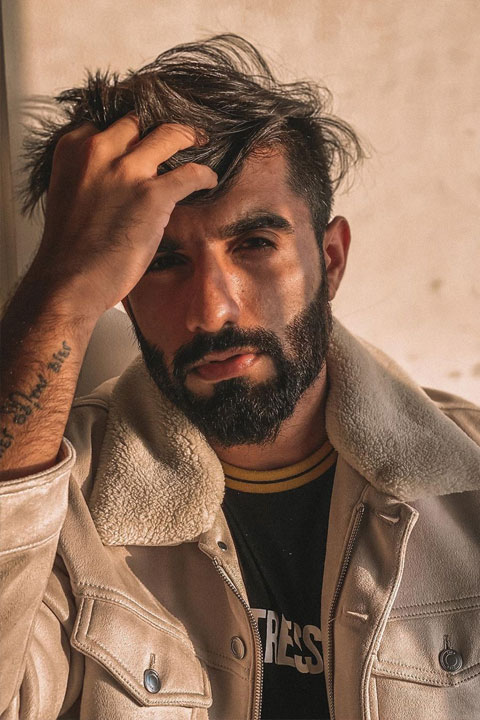 Manav Chhabra looking amazing and dashing with his beard, tattoo and jawline.