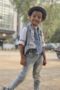 famous Indian Tiktok Star Sadim Khan wearing cute hat and tie and posing for the camera