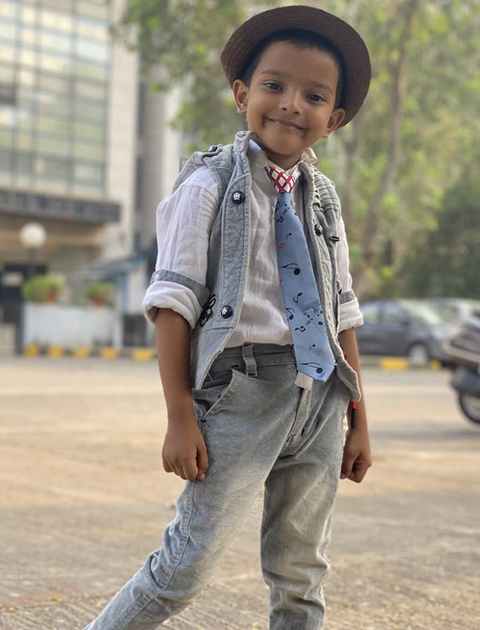 Sadim Khan wearing cute hat and tie and posing for the camera