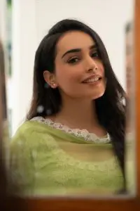 Indian Tiktok Star Barbie Maan looking cute and beautiful in green traditional dress and her black straight hair.