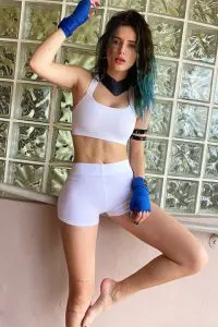 Bella Thorne wearing Blue gloves and wearing white pair