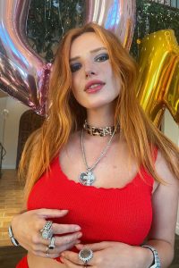 Bella Thorne in red dress and wearing jelwery