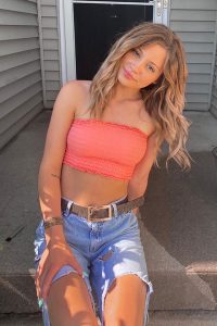 faleshafayee in peach top and stylish blue jeans