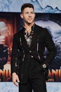 Nick Jonas is looking gorgeous in full black dress and watch