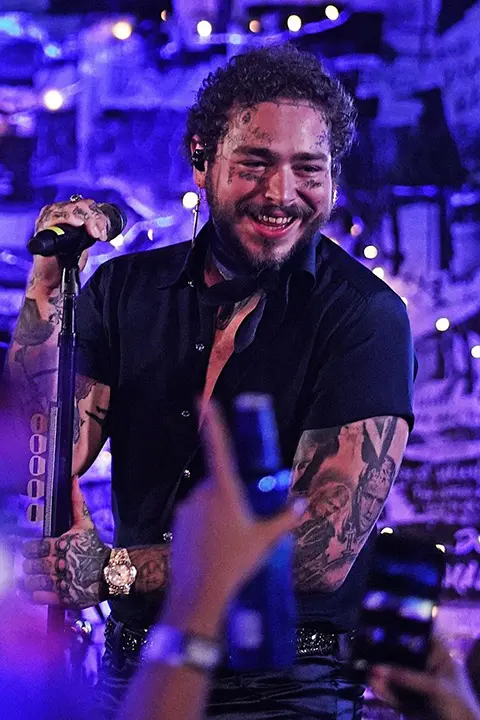 Post Malone smiling at concert