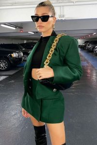 Hailey Bieber in green dress at parking longue