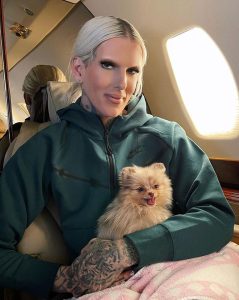 JeffreeStar with his pet dog in his private jet plane