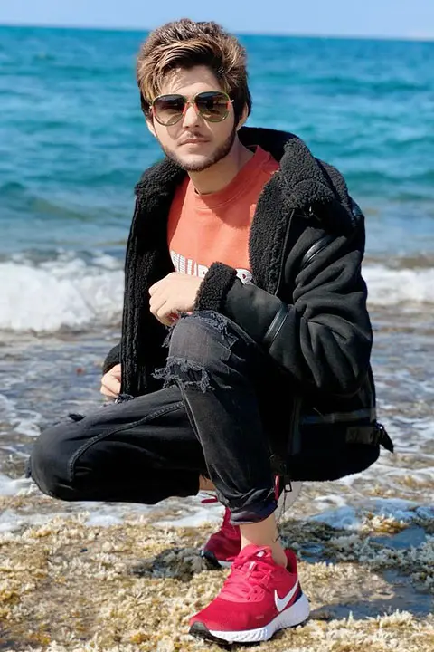 Nadeem Mubarik a Famous tiktok star posing onside beach with his classy look in his black shades