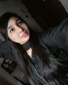 Neha Hussain taking selfie in black dress