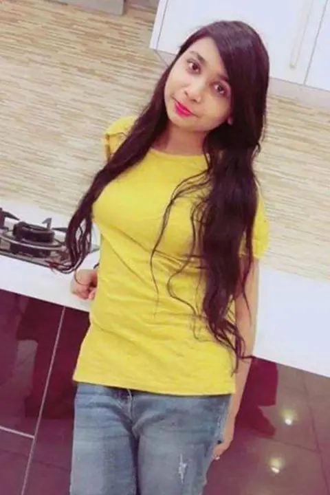 Neha Hussain in yellow shirt and blue jeans