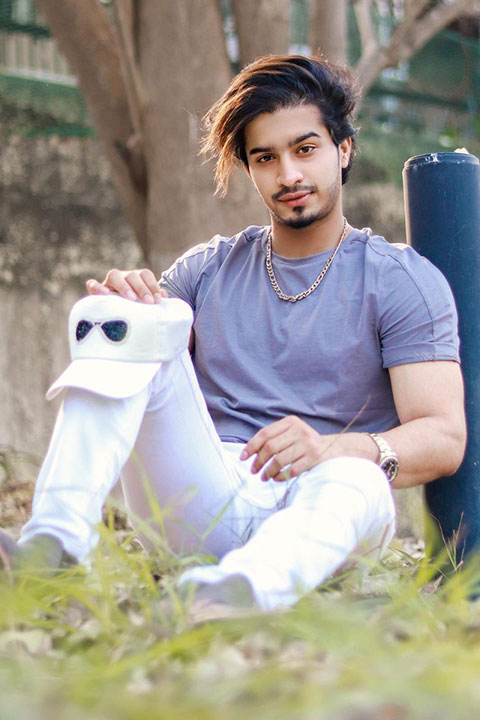 Faiz Baloch purple tshirt and white pent