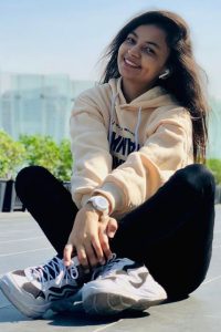 famous Indian Tiktok Star Mamta Acharya in cream color hoodie and black pent