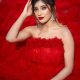 Somya Daundkar is looking like a queen in red dress and white crown.