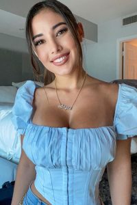 Angie Varona is looking beautiful in blue shirt and jeans and her pendant is looking awesome.