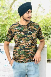 famous Indian Tiktok Star Jagjodh Bela leather jacket wearing army themed shirt and blue jeans