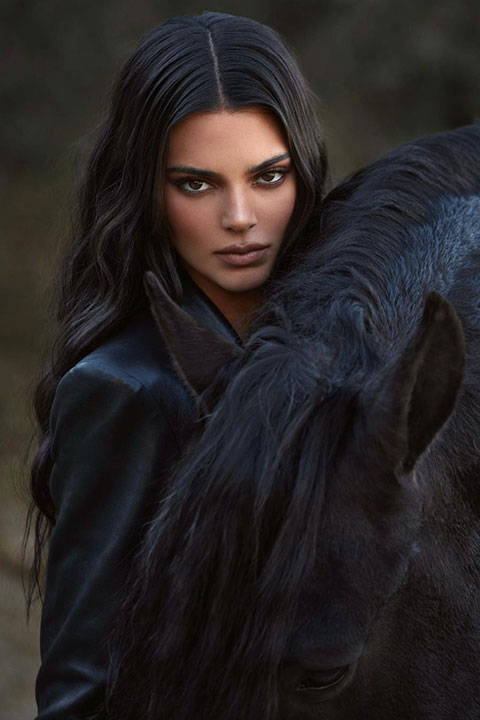 Kendall Jenner taking picture her black horse