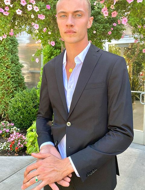 Lucky Blue Smith is looking beautiful in pent coat and posing for a picture.