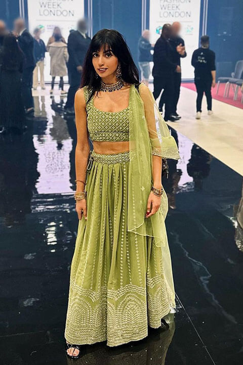 Aaliyah Yasin in a green lehenga at London Fashion Week
